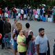 People queue to collect water from a spring in the Newlands suburb of Cape Town